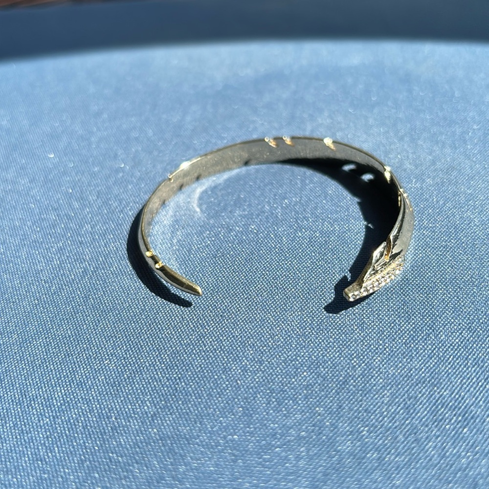 Gold cuff bracelet.